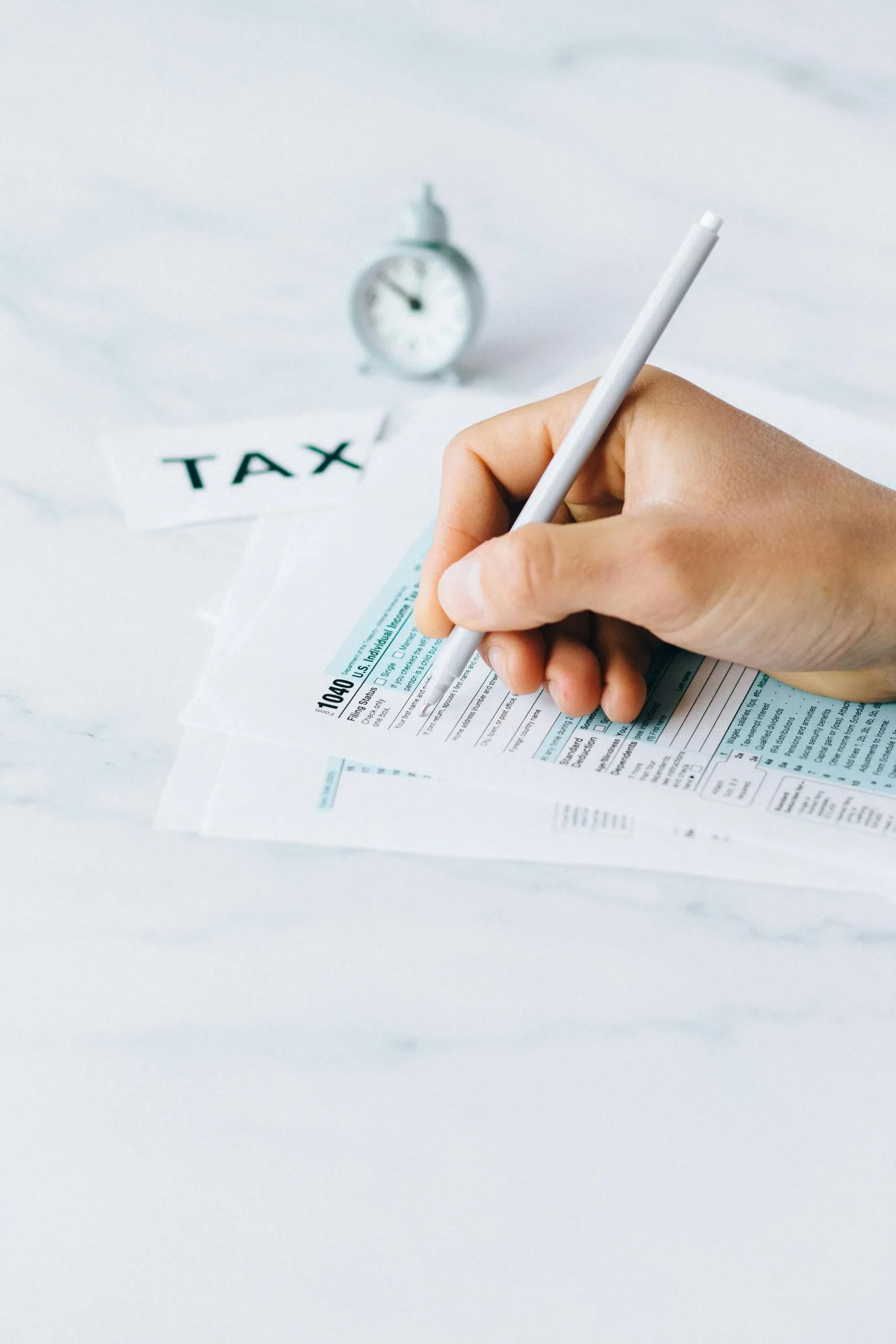 person filling in tax forms