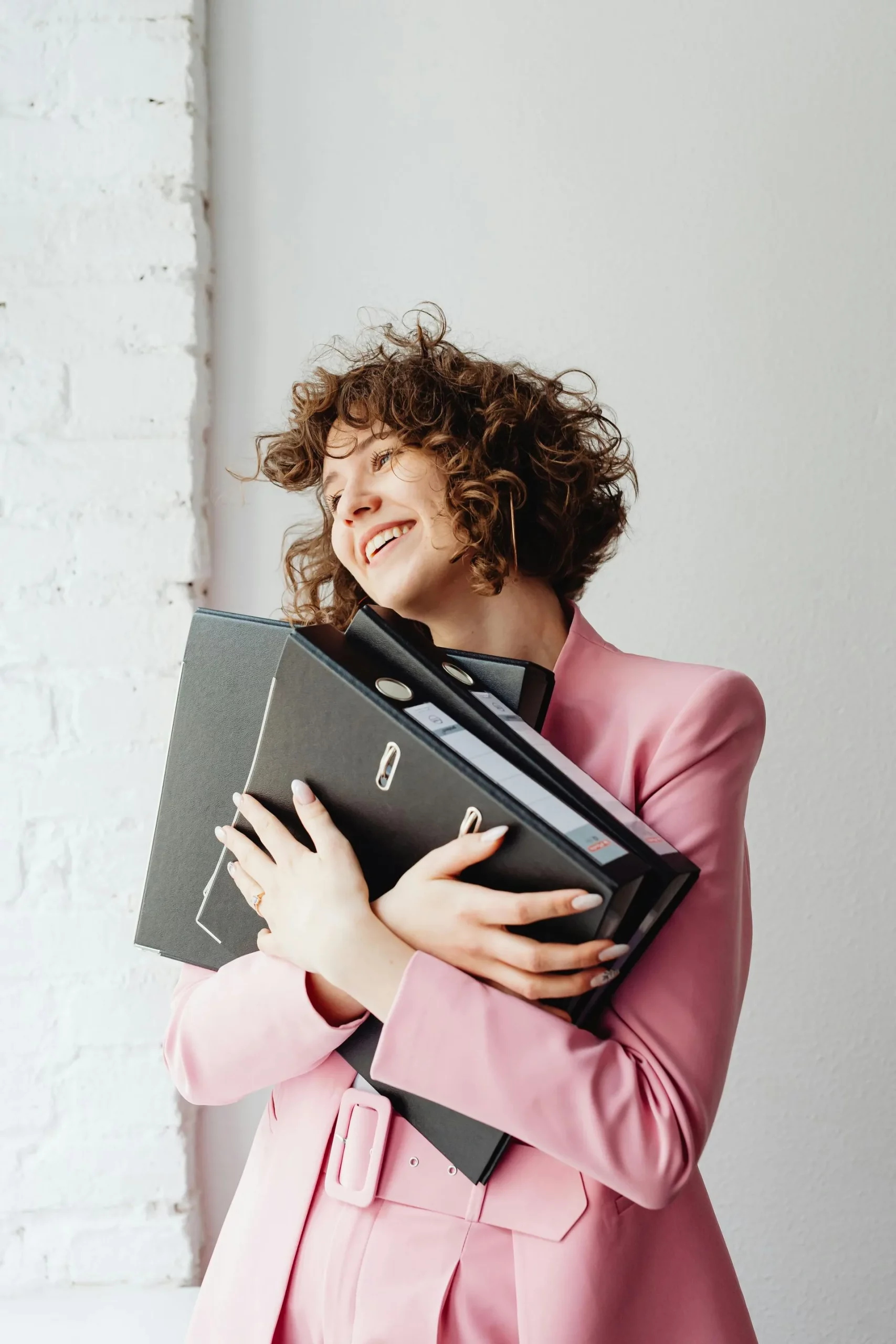 person holding folders